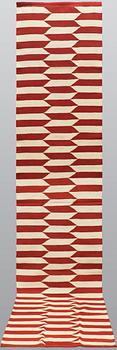 A runner, flat weave, ca 397 x 83 cm.