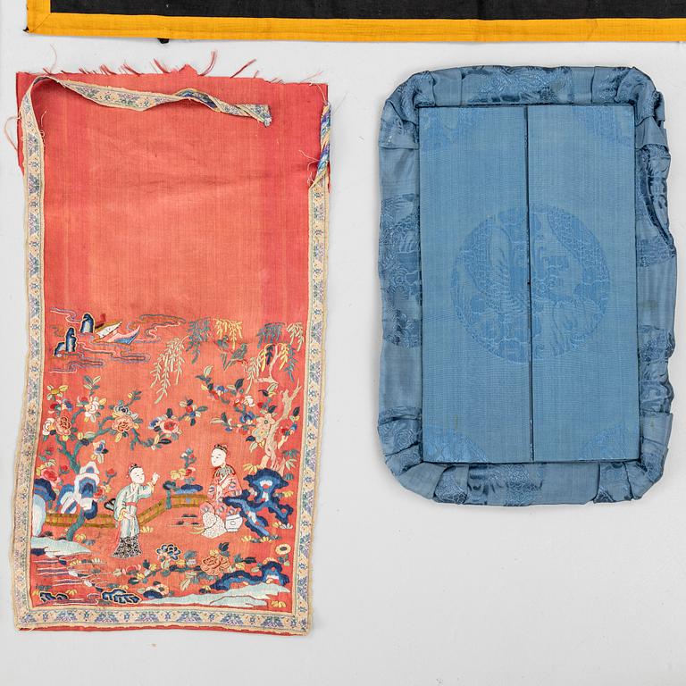 A group lot of embroidered silk textiles and a silk sowing purse, late Qing dynasty/early 20th century.