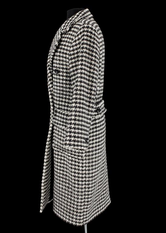A 1984s coat by Yves Saint Laurent.