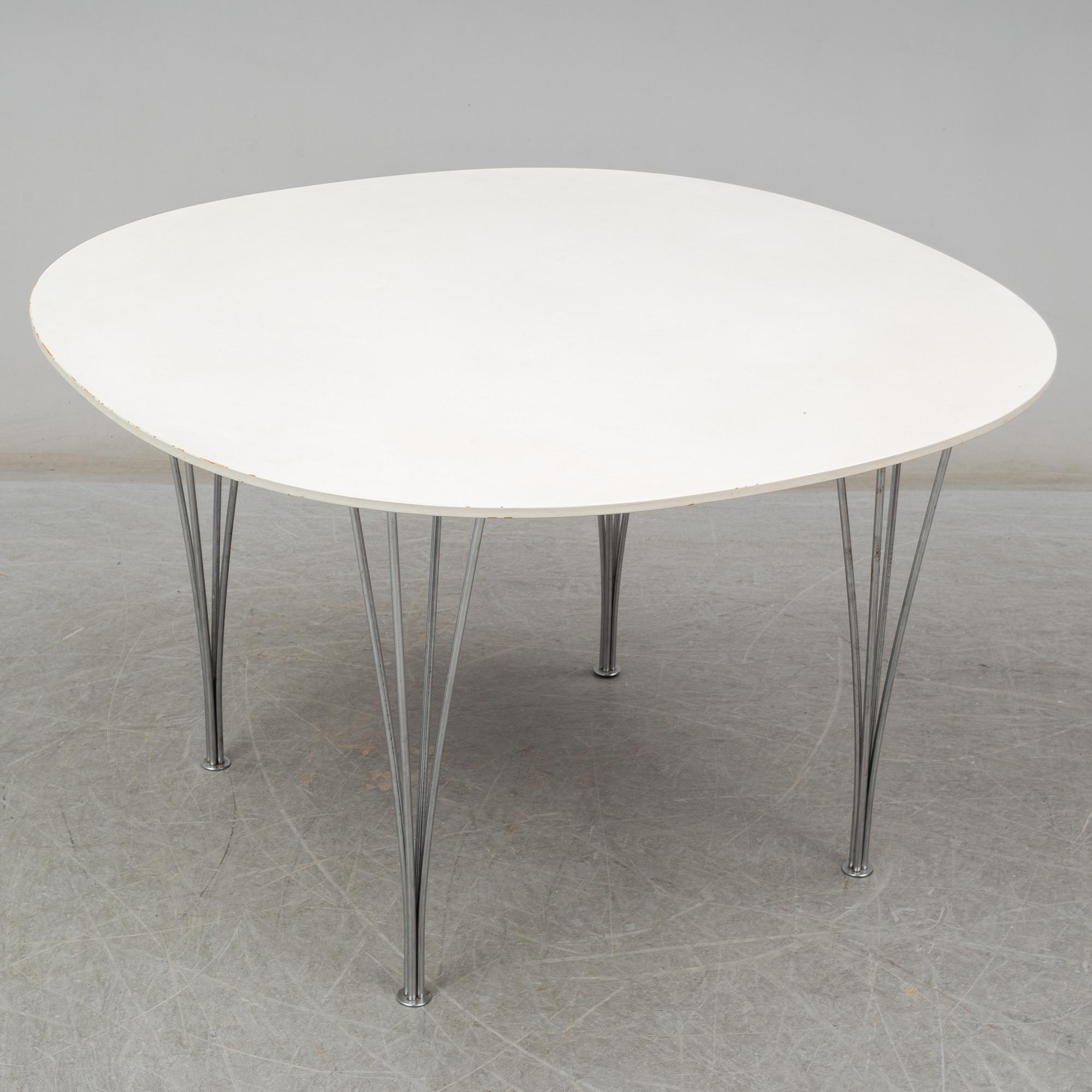 BRUNO MATHSSON & PIET HEIN, and ARNE JACOBSEN, a 'Supercirkel' table and two 'Myran' chairs, from Fritz Hansen.