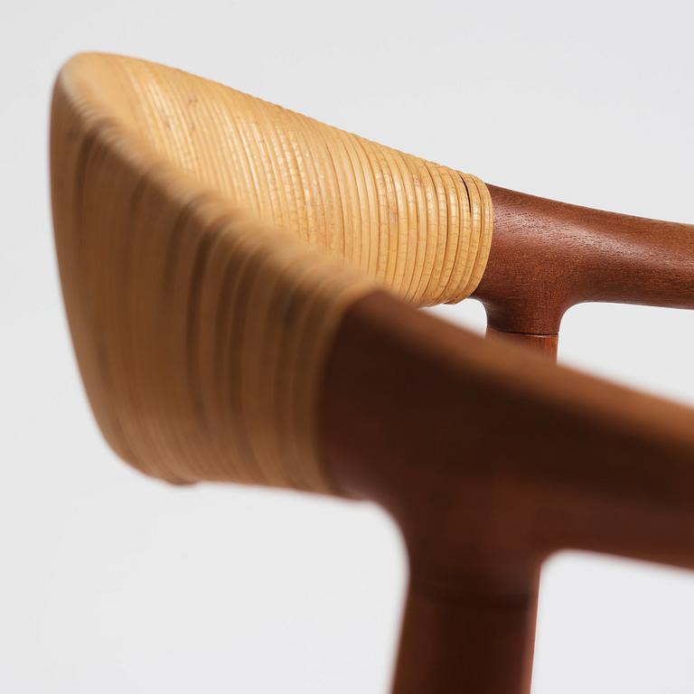 Hans J. Wegner, a pair of teak and rattan 'The Chair', JH-503, Johannes Hansen, Denmark 1950s.