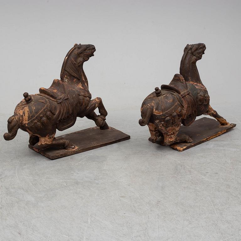 Two large wooden sculptures of horses, 20th century.