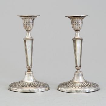 HARRISON BROTHERS & HOWSON, a pair of silver and mother of pearl candlesticks from Sheffield, England, 1926.