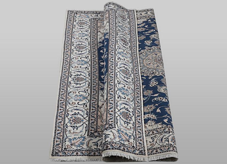 A carpet, Nain, part silk, ca 294 x 198 cm.