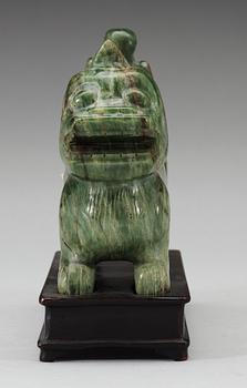 A nephrite figure of a Buddhist Lion, late Qing dynasty.