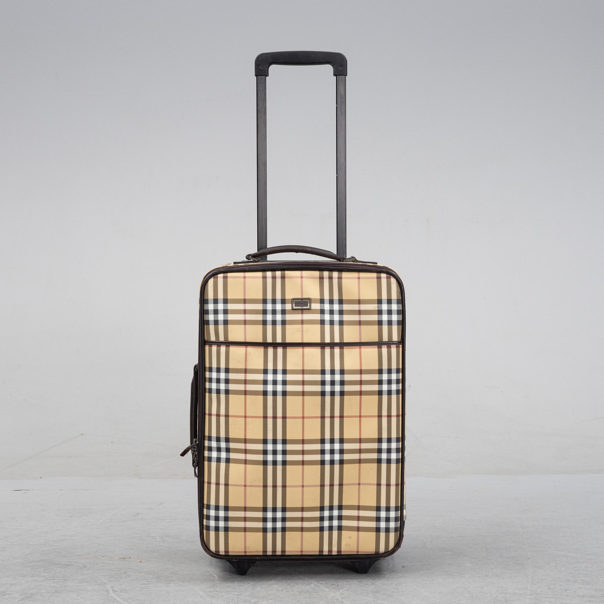 Burberry, a Nova Check canvas suitcase.