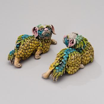 A pair of ceramic Chinese temple dogs from the first half of the 20th century.