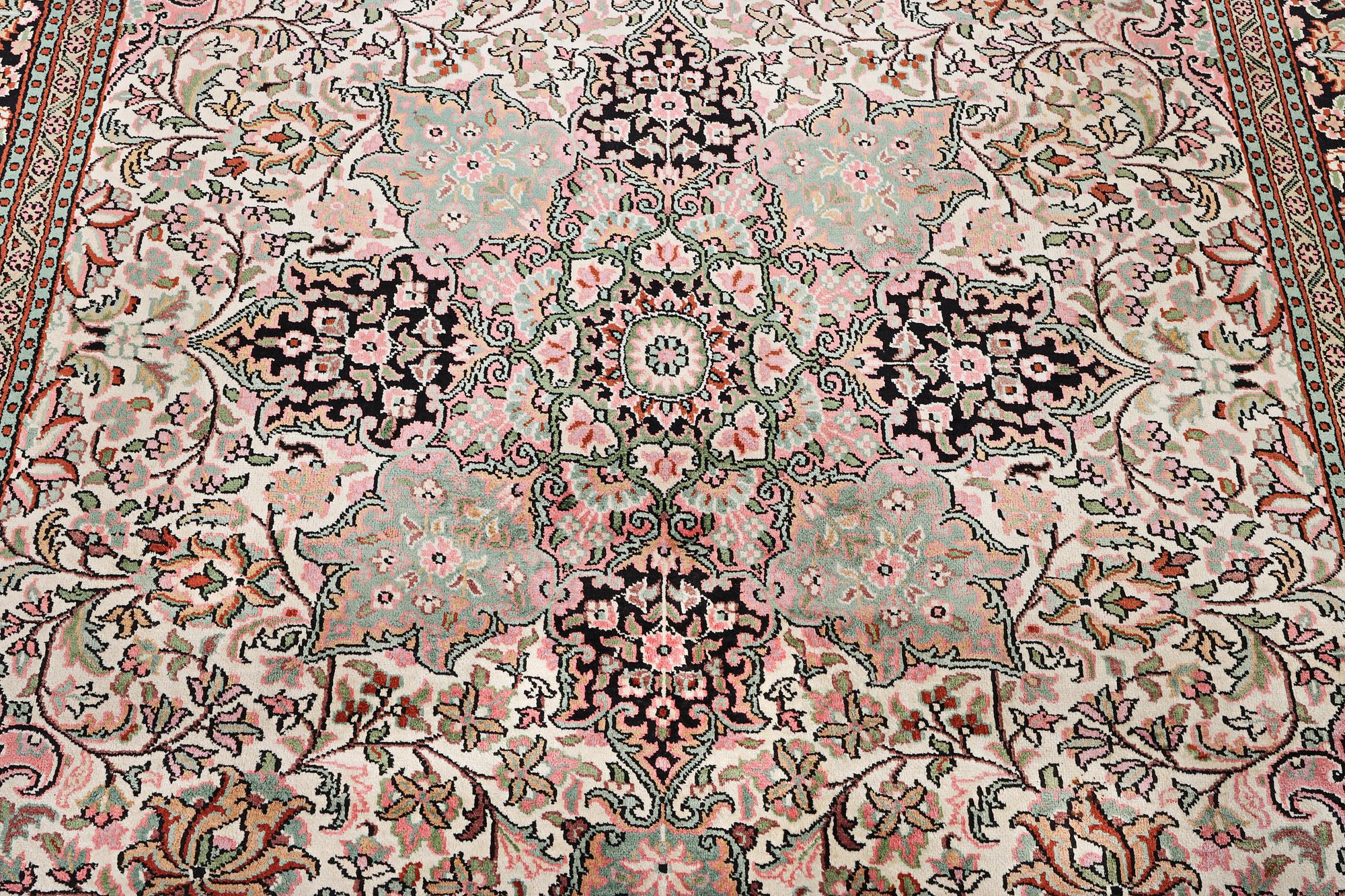 A silk Kashmir carpet, c. 267 x 185 cm.