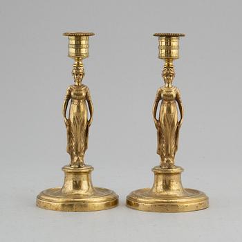 A pair of late Gustavian bronze candlesticks, early 19th century.