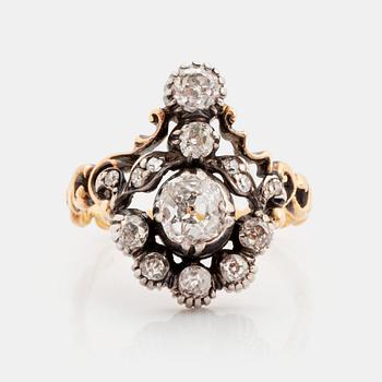 An 18K gold and silver ring set with old-cut diamonds.