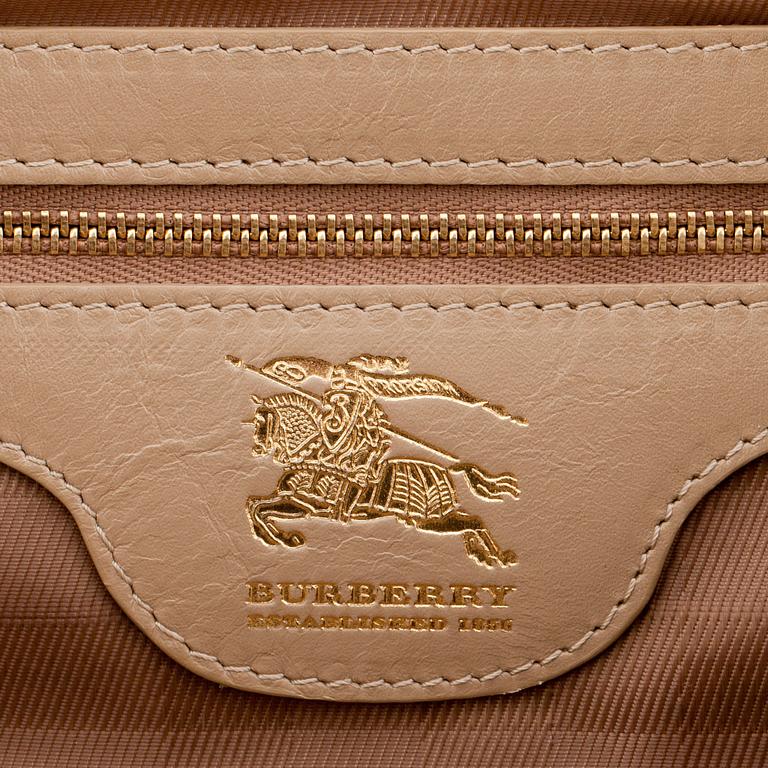 BURBERRY, a beige leather weekend bag.