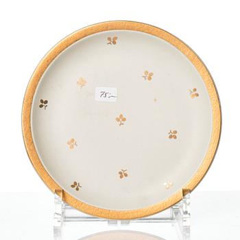 Wilhelm Kåge, 15 pieces of "Carrara" and "Gold Carrara" stoneware dishes, Gustavsberg, Sweden, 1930s/40s.