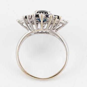 Ring 18K white gold with dark sapphires, pear-shaped and brilliant-cut diamonds.