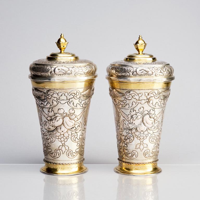 A pair of Russian Baroque parcel-gilt silver cups and covers, mark of Nikifor Timofeev, Moscow 1729.