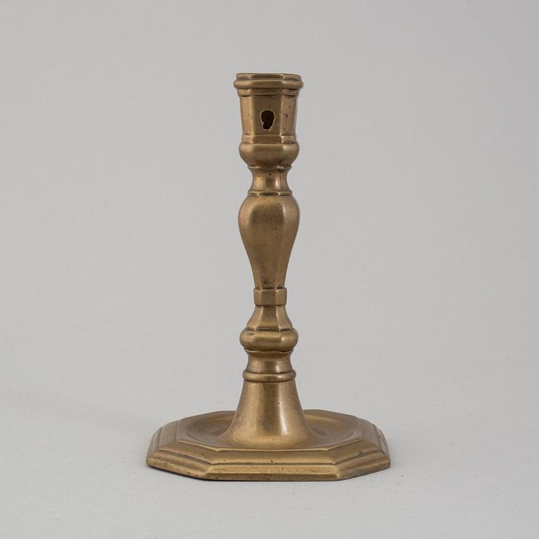 An 18th century bronze candlestick.