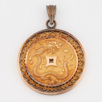 18K gold pendant.