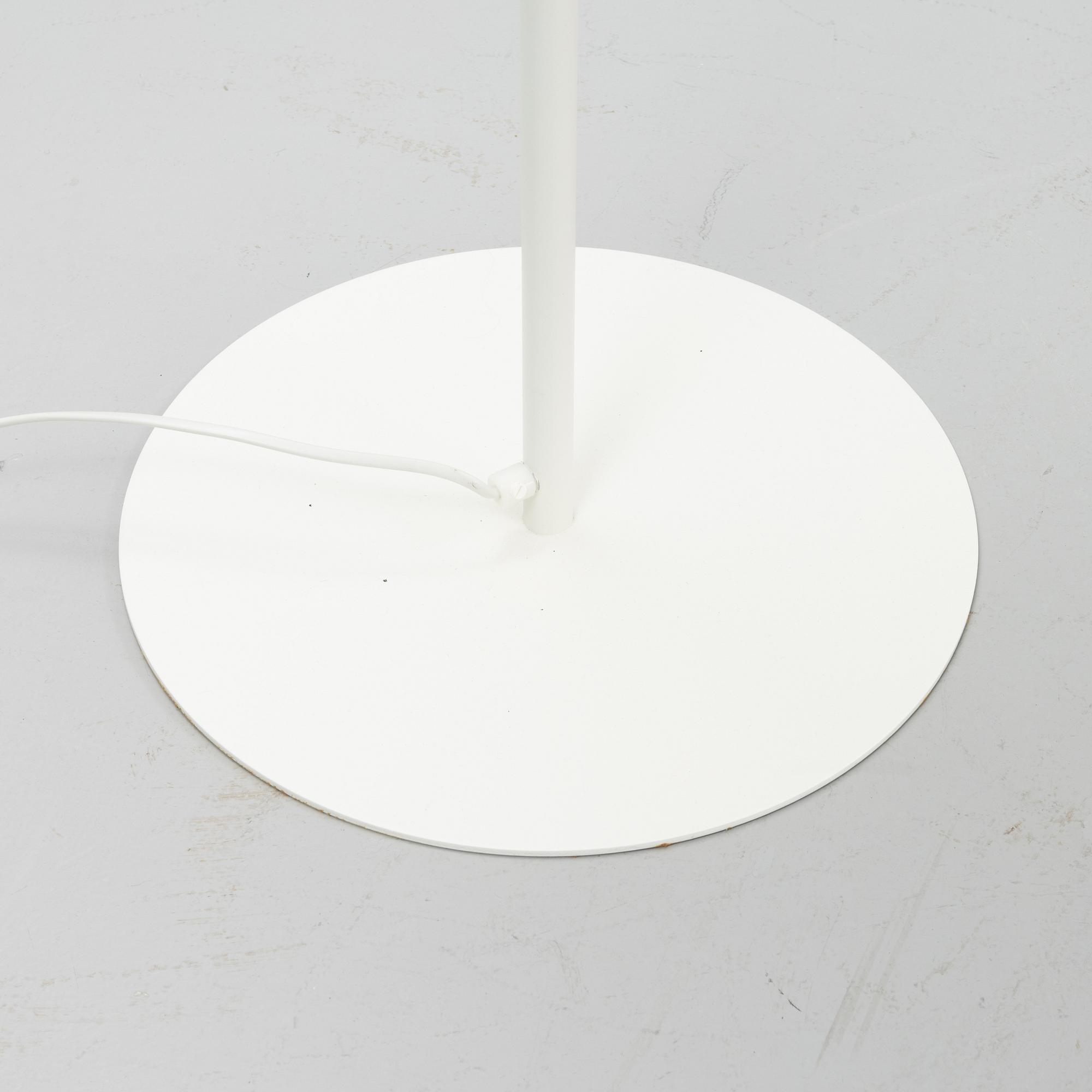 A white metal floor light, Luxus, Vittsjö.