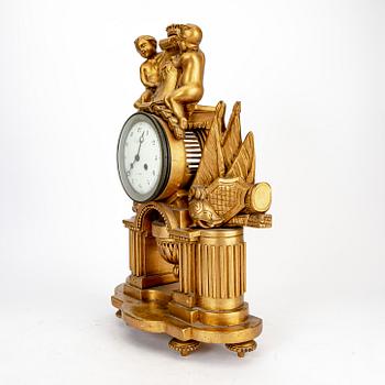 An Empire gilded table clock marked Vaillant Paris.