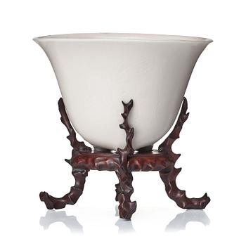 A rhinoserous shaped blanc de chine libation cup, Qing dynasty.