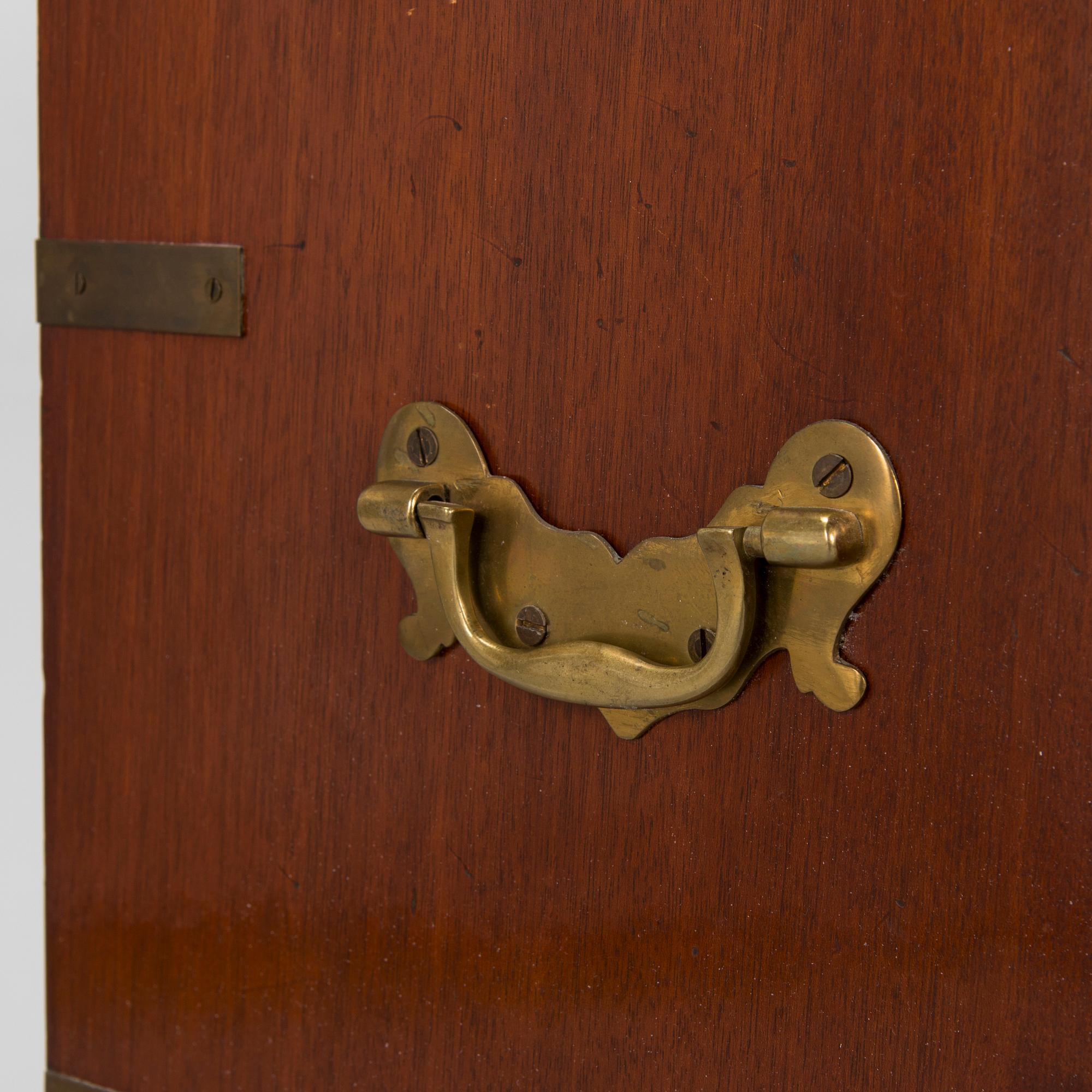 A chest of drawers, England, second half of the 20th century.
