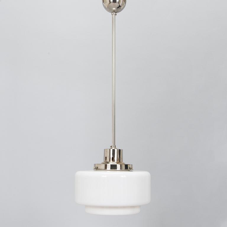 Paavo Tynell, kattovalaisin, malli 2004, Taito 1930-luku.