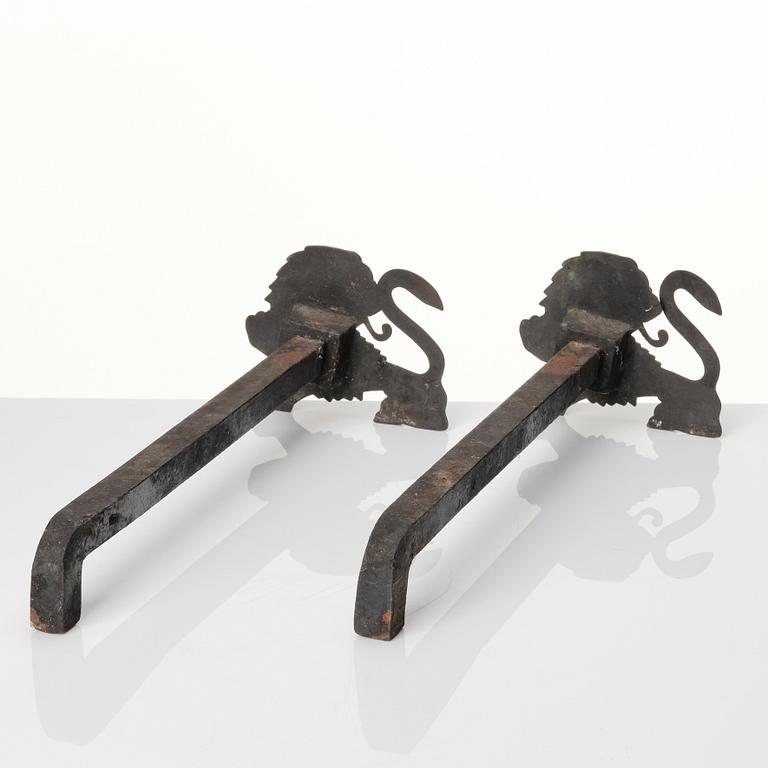 Anna Petrus, a pair of brass and iron andirons, Svenskt Tenn Sweden.