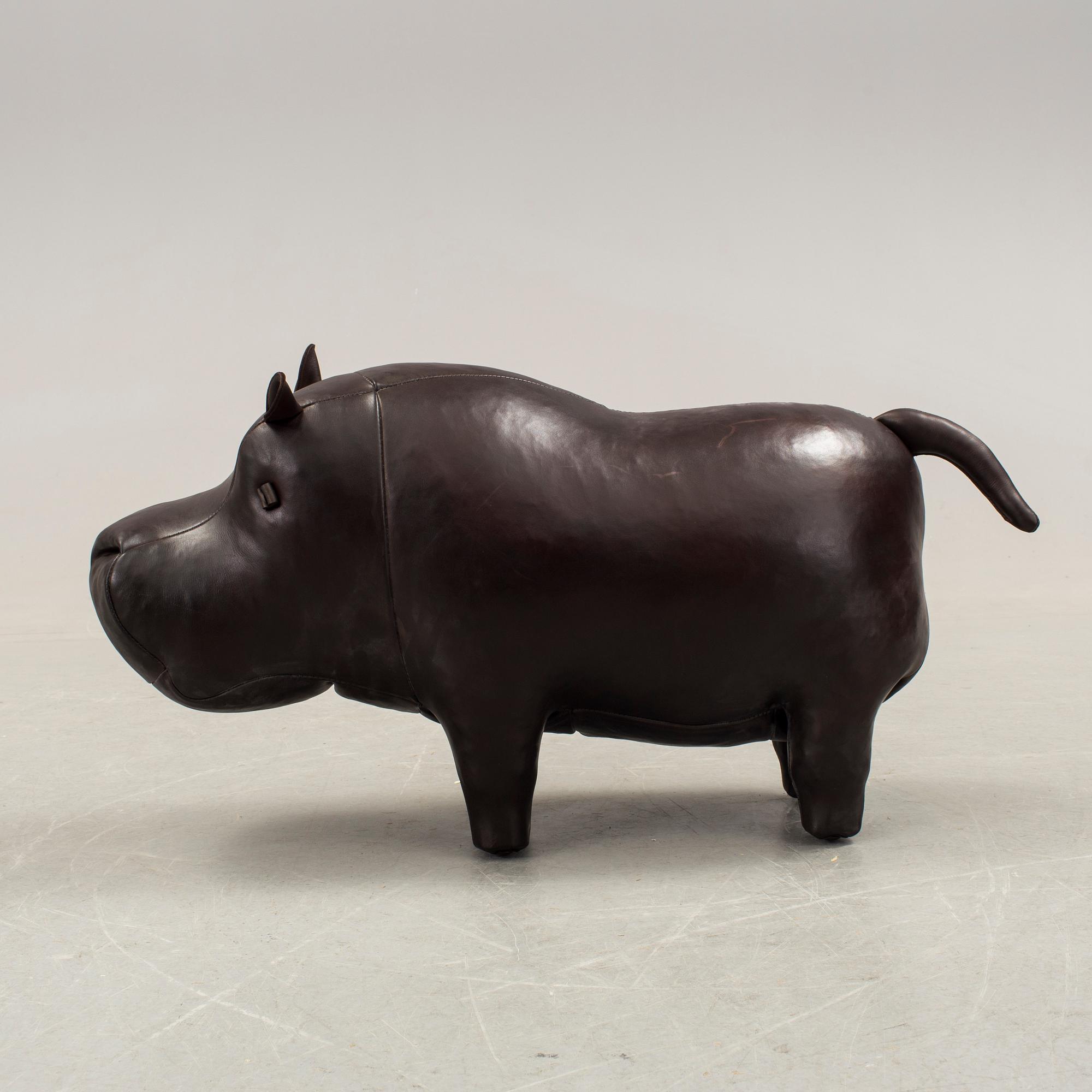 DIMITRI OMERSA & CO, a leather footstool in the shape of a hippo.