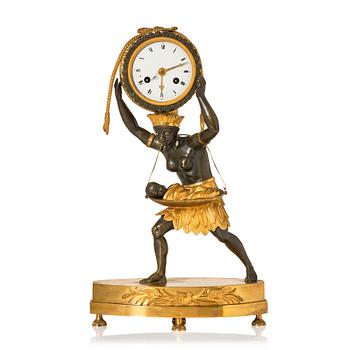 127. An Empire ormolu and patinated-bronze mantel clock 'La Nourrice Africaine', early 19th century.