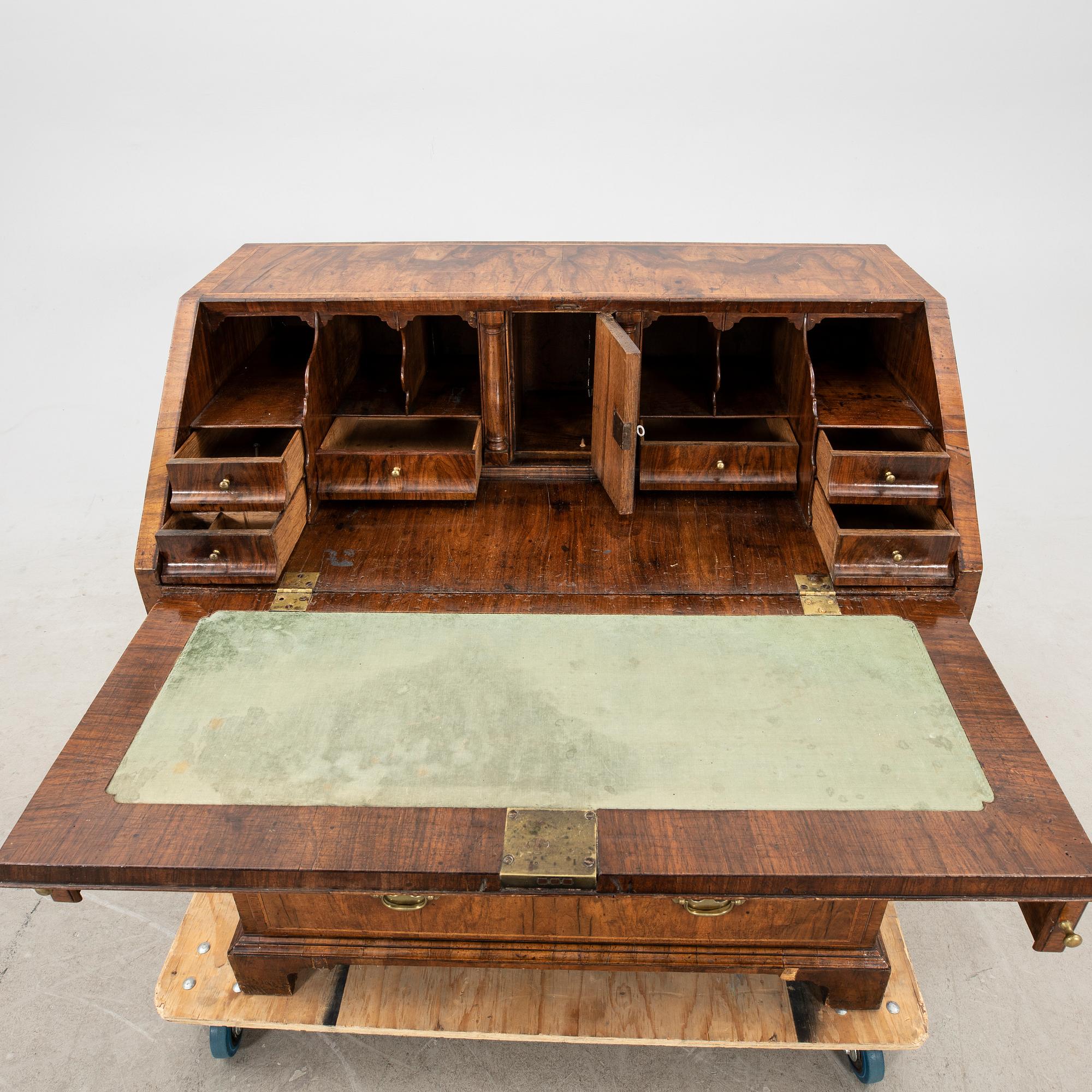 A walnut and mahogany writing bureau, mid-18th century late Baroque.