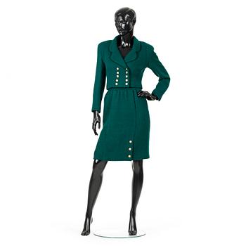 CHANEL, a two-piece suit consisting of short jacket and skirt.