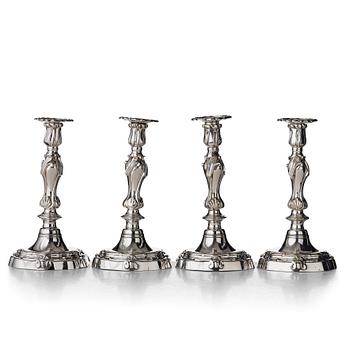 Four Louis XV mid 18th century candlesticks.