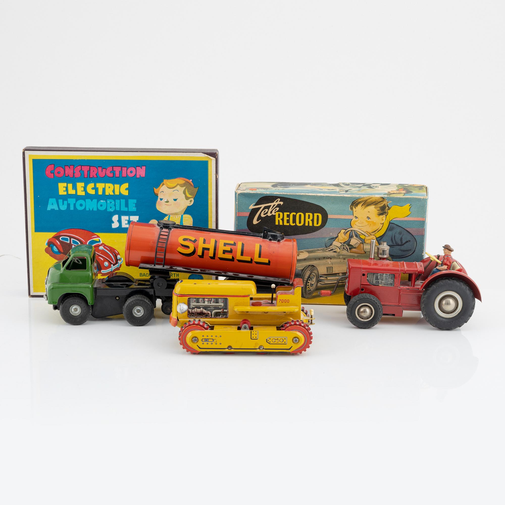 Five tin toys, including Arnold and Gama, 20th Century.