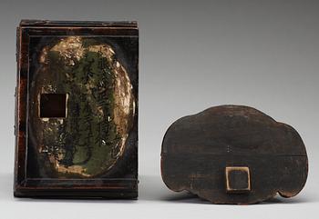 A lacquered wooden Japanese deity on a stand, 19th Century.