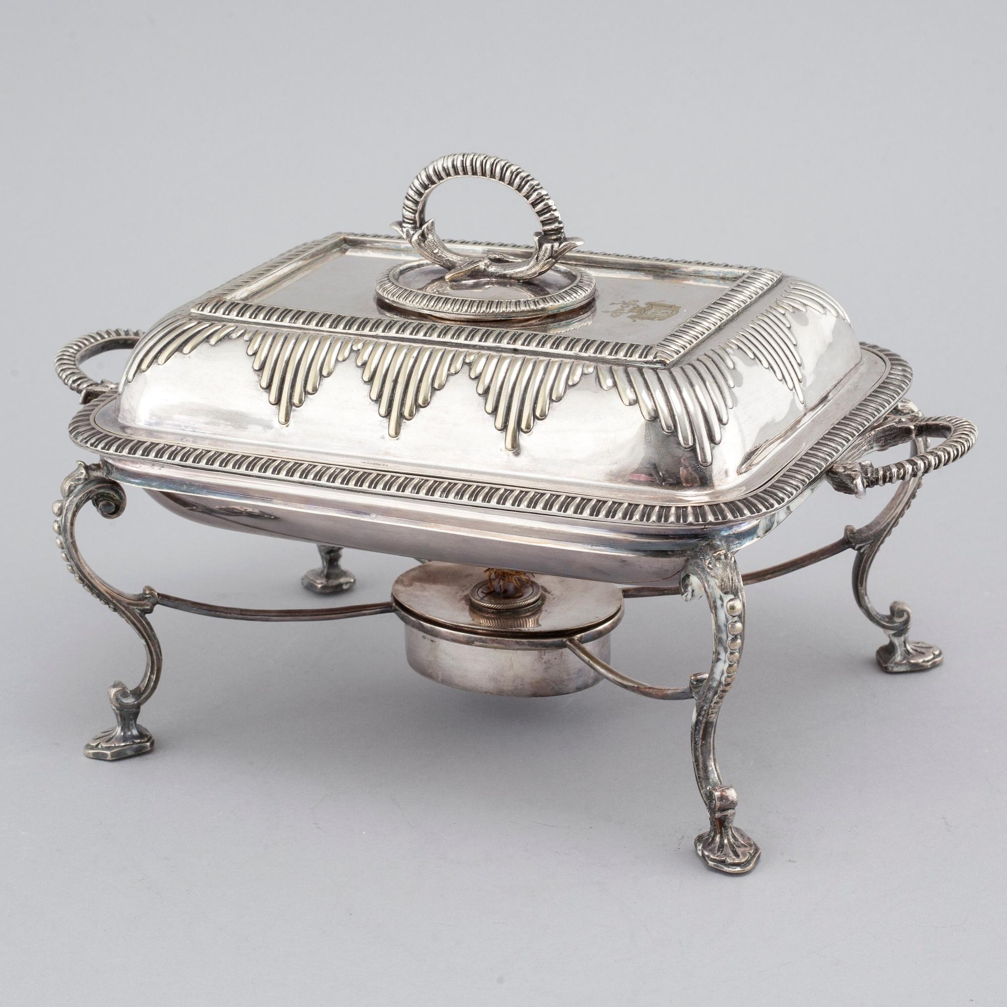 A silvered metal serving dish with rechaud, first half of the 20th century.