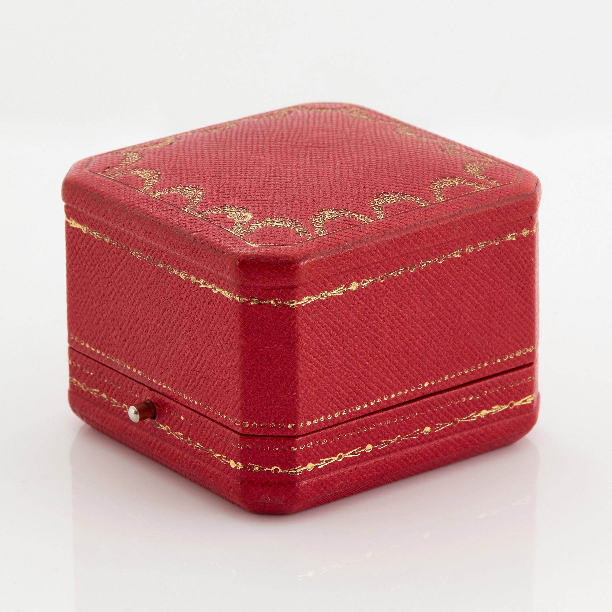 Cartier "Marrakech" an 18K gold bombé ring set with round brilliant-cut diamonds.