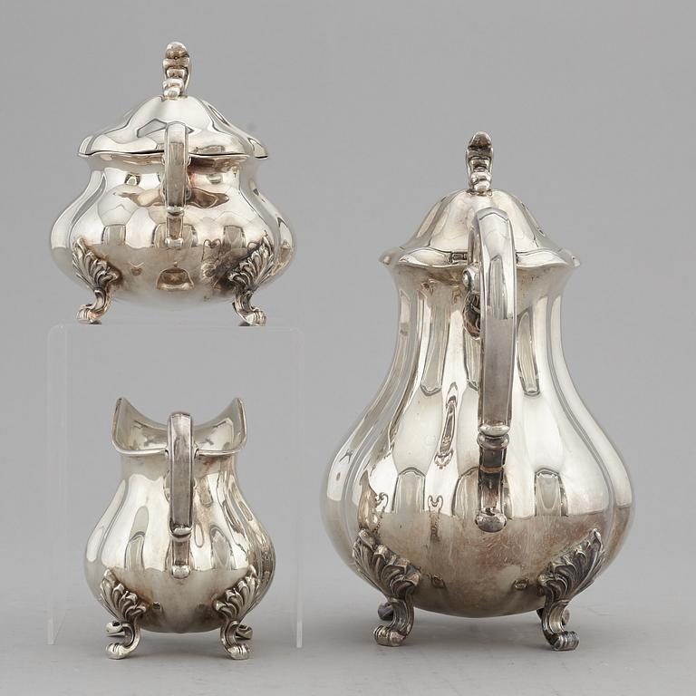 A silver coffee pot, creamer and sugar bowl, swedish import mark.