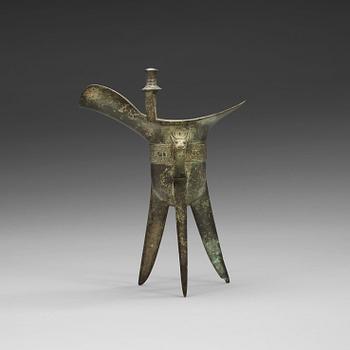 115. An archaic bronze ritual libation vessel (Jue), presumably Shang dynasty (1600 BC-1046 BC).