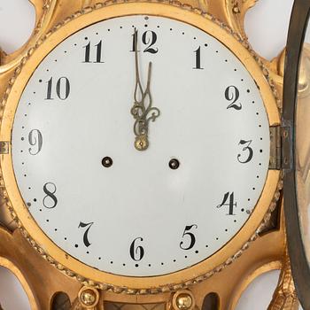 A Gustavian style pendulum wall clock, 20th Century.