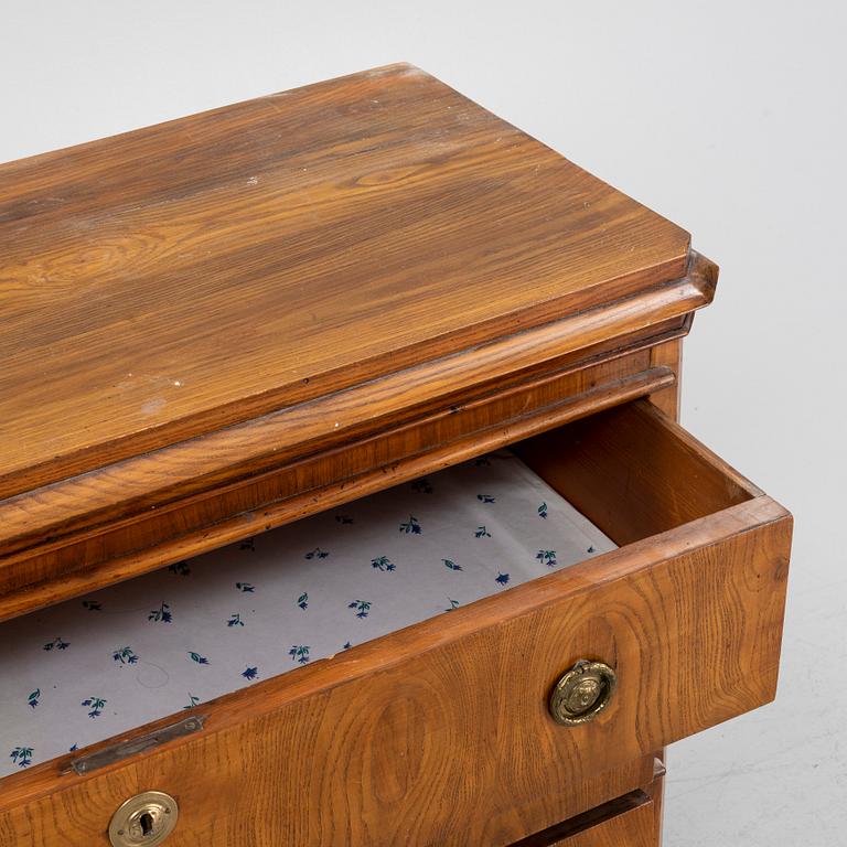 A Gustavian style oak veneered chest of drawers, around 1900.