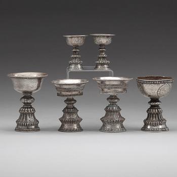 A group of six Tibetan silver/silvered Butter lamps, 19th Century.