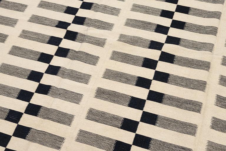 A flat-woven rug, c. 232 x 175 cm.