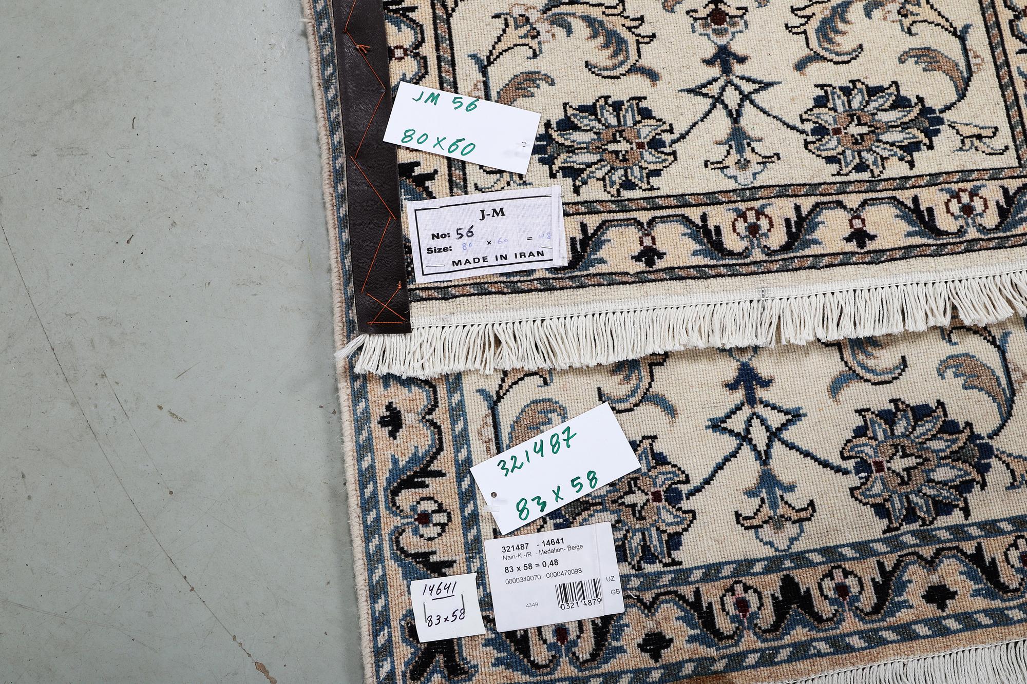 A pair of rugs, Nain, part silk, ca 80 x 60 cm 
 & ca 83 x 58 cm.