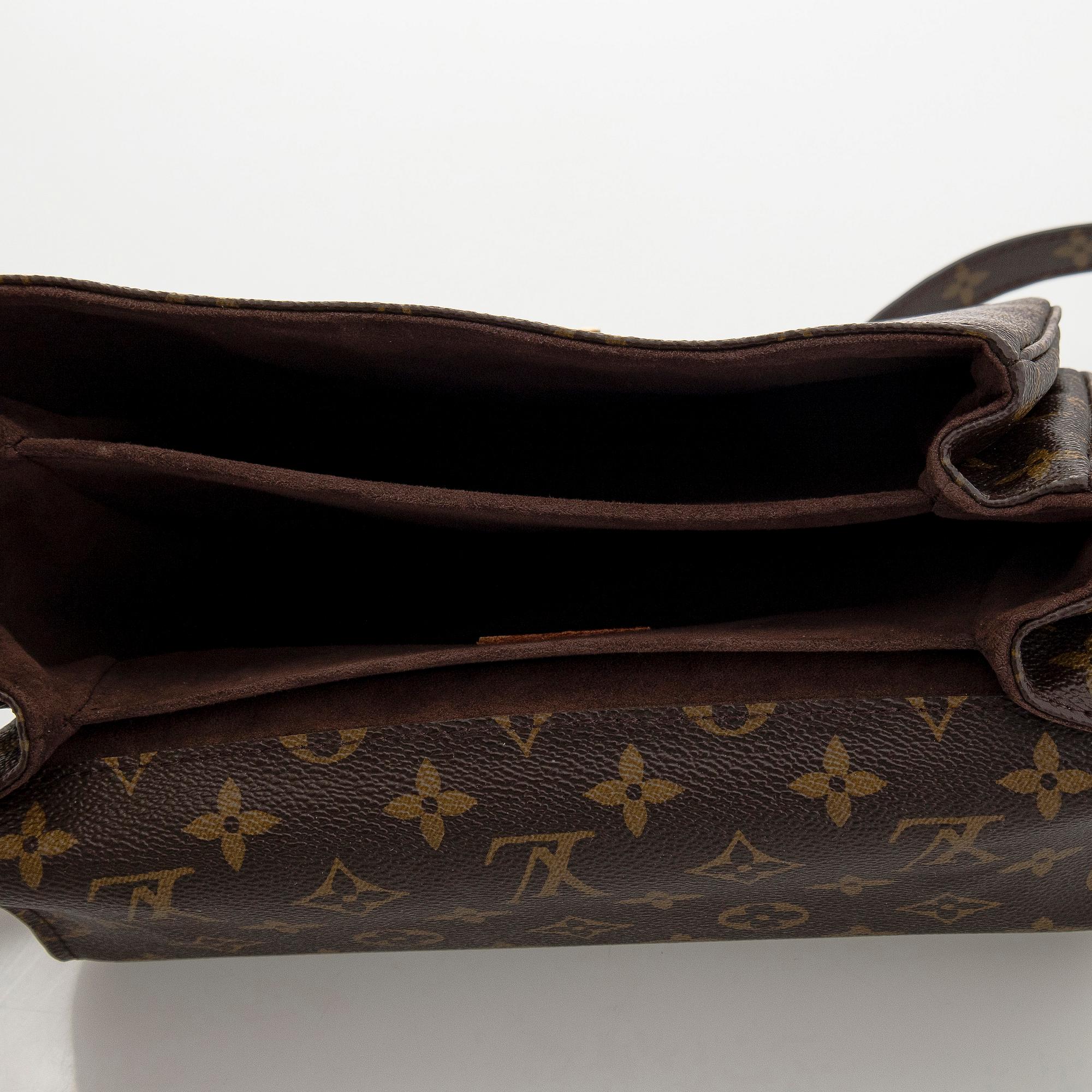 Louis Vuitton, a Monogram Canvas 'Pochette Metis' bag.