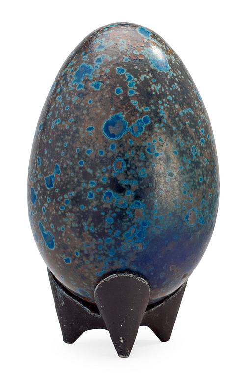 A Hans Hedberg faience egg on an iron base, Biot, France.