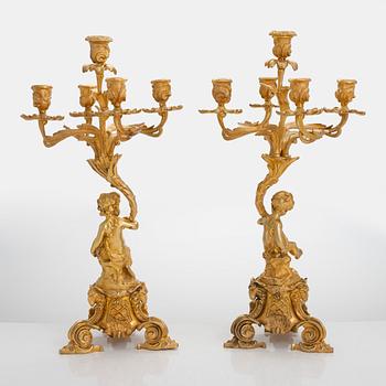 A pair of gilt bronze candelabra from the latter half of the 19th century.