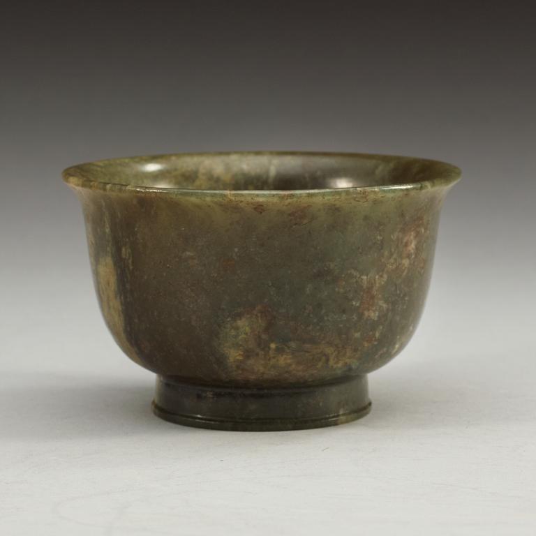 A green marble bowl, Qing dynasty (1644-1912), with Qianlong six character mark.