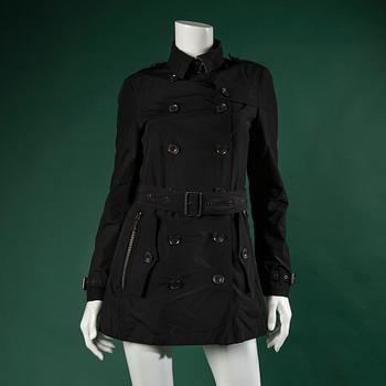 A TRENCHCOAT by BURBERRY, in size 4.