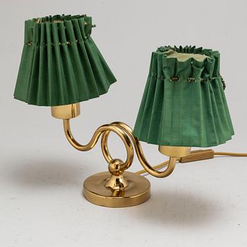 JOSEF FRANK, a brass table lamp for two lights, model 2483, Svenskt Tenn, provenance Estrid Ericson.