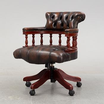 An English mahogany desk chair, 20th Century.