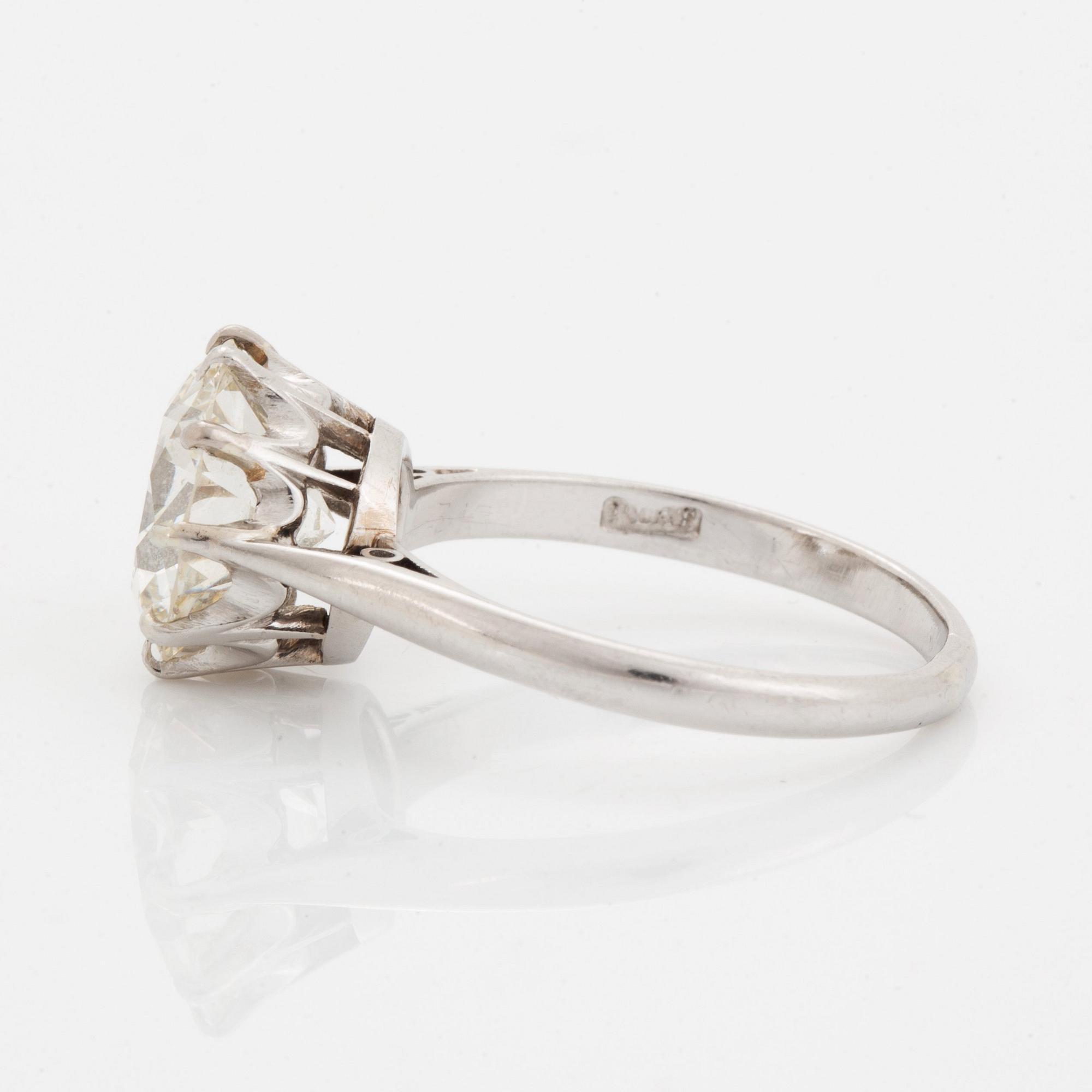 A platinum ring set with an old-cut diamond ca 3.30 cts quality ca J/K vs.